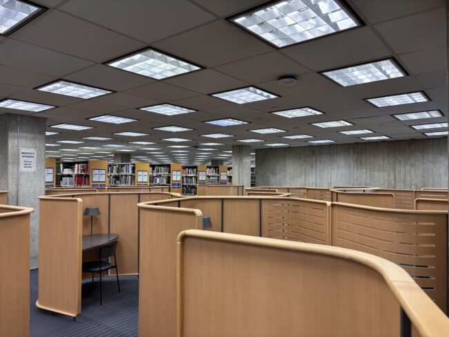 View of individual study pods and bookshelves on 7th floor
