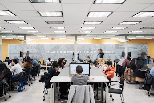 Computer lab filled with students using the space.
