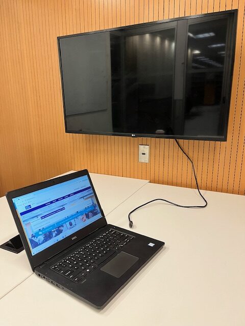 Laptop with HDMI cable and screen
